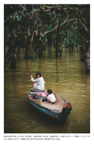 Cambodia, Kampong Phluk, Grandmother & child in Boat