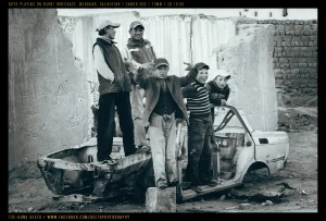 Murghab boys & burnt out car